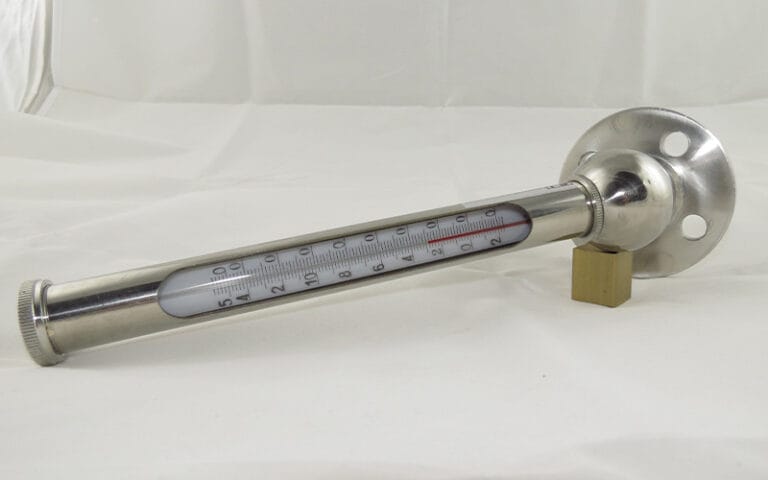 Glass tube thermometer with metal housing and flange