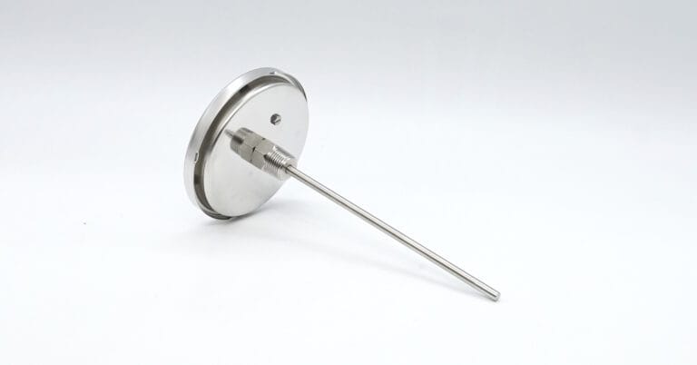 Rear view of an industrial thermometer showing its long sensing stem and threaded process connection